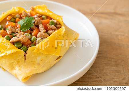 egg wrap or stuffed egg with minced pork and vegetable egg wrap or stuffed egg with minced pork and vegetable 103304397