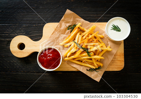 French fries with sour cream and ketchup French fries with sour cream and ketchup 103304530