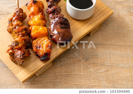 Japanese chicken grill or yakitori serve in izakaya style Japanese chicken grill or yakitori serve in izakaya style 103304890