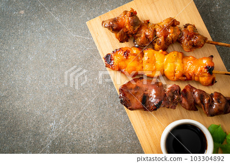 Japanese chicken grill or yakitori serve in izakaya style Japanese chicken grill or yakitori serve in izakaya style 103304892