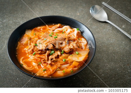 Korean udon ramen noodles with pork in kimchi soup 103305175