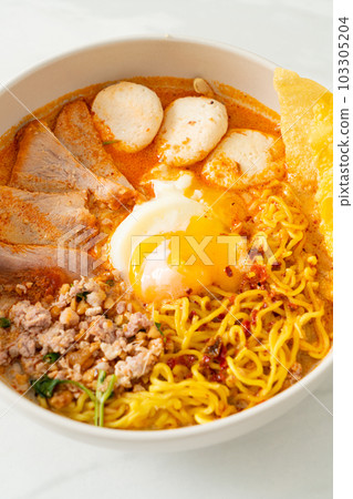 egg noodles with pork and meatball in spicy soup egg noodles with pork and meatball in spicy soup 103305204