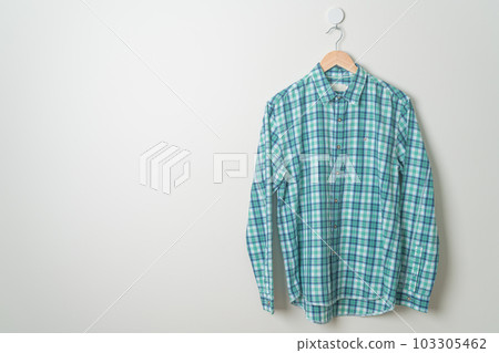hanging shirt with wood hanger on wall hanging shirt with wood hanger on wall 103305462