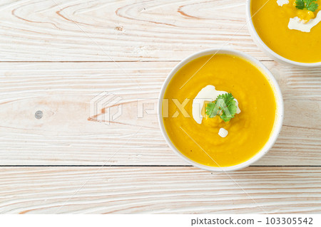 pumpkin soup in white bowl pumpkin soup in white bowl 103305542