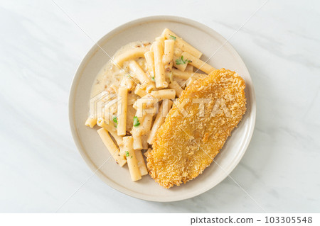 quadrotto penne pasta white cream sauce with fried fish 103305548