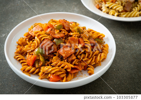 fusilli pasta with ham and tomatoes sauce fusilli pasta with ham and tomatoes sauce 103305877