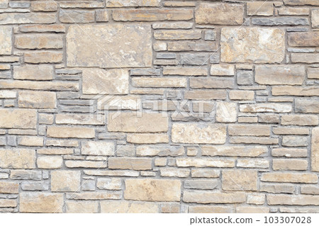 Solid gray and beige stone wall, good for background 103307028