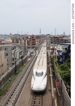 A train running near Hiyoshi Tunnel on the Tokaido Shinkansen A train running near Hiyoshi Tunnel on the Tokaido Shinkansen 103307500