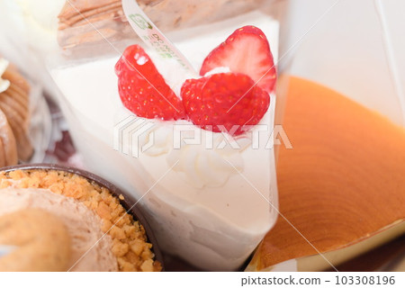 Strawberry shortcake surrounded by cakes 103308196