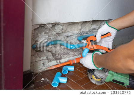 Plumber must open a wall to access a broken pipe. 103310775