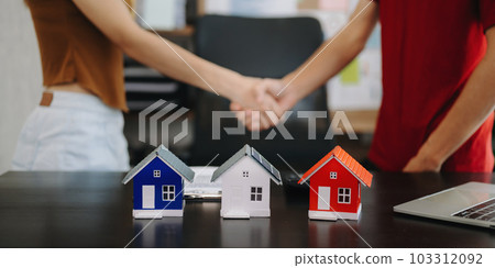 Signing a contract. Client and broker agent, lease agreement, successful deal and  Young business sitting at the desk 103312092