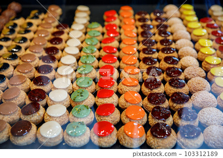 French pastries on display in store window of cafe or bakery. 103312189