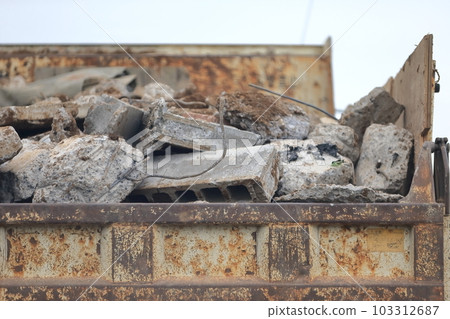 Truck transporting concrete debris 103312687