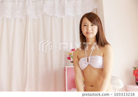 Girl's room in a white swimsuit Girl's room in a white swimsuit 103313216