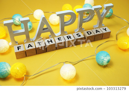 Happy Fathers Day alphabet letter with LED cotton balls on yellow background Happy Fathers Day alphabet letter with LED cotton balls on yellow background 103313279