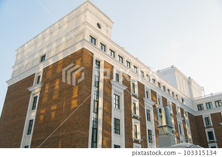 Part of Modern residential apartment with flat building exterior. Detail of New luxury house and home complex. Fragment of City Real estate property and condo architecture. 103315134