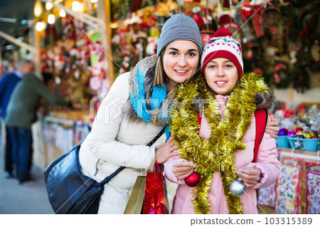 Female customers staring at counter of Christmas market 103315389