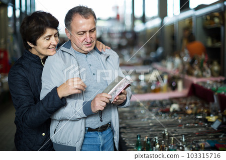Mature man and woman at traditional flea market 103315716