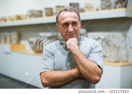 Adult male in historical museum Adult male in historical museum 103315920