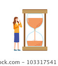 woman looking at hourglass 103317541