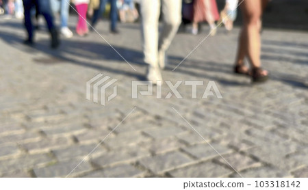 lurred background of people walking 103318142