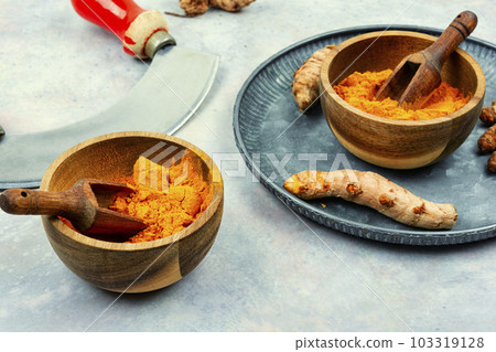 Turmeric root and turmeric powder, medicine herb. Turmeric root and turmeric powder, medicine herb. 103319128