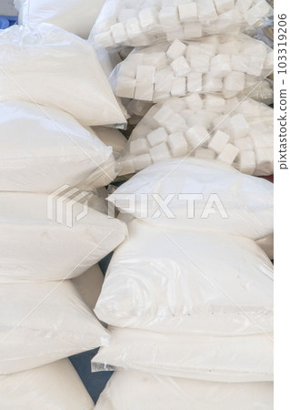 cube and granulated sugar in transparent bags at market cube and granulated sugar in transparent bags at market 103319206