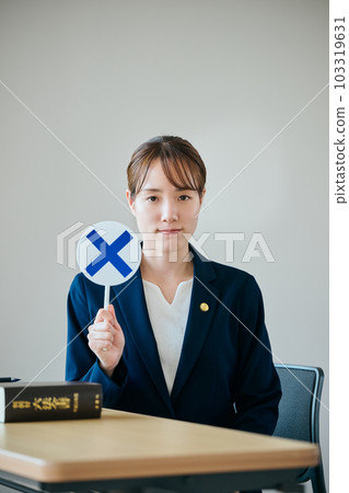 A young female lawyer who judges embarrassment A young female lawyer who judges embarrassment 103319631