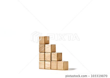 Wood cubes stacked as stair step shapes on white Wood cubes stacked as stair step shapes on white 103319870