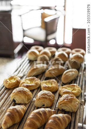 selection of pastries and bread on display in french cafe buffet 103319976