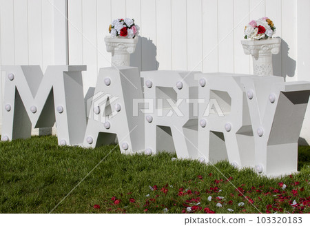 Letters spelling Marry in a back yard Letters spelling Marry in a back yard 103320183
