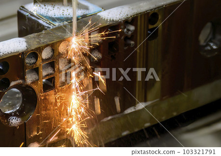 Closeup scene the wire EDM machine cutting the mold insert parts. 103321791