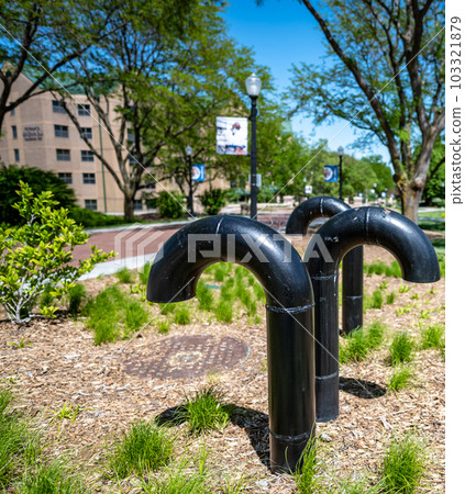 Underground structure manhole ventilation pipe in the shape of a candy cane. 103321879
