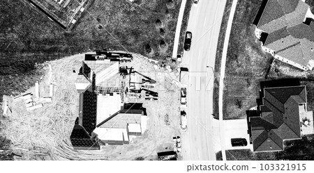 Drone overhead view or a roof installation with felt and water barrier being added. 103321915