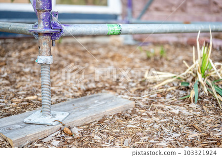 Typical leveling support block as the baseplate of an erected scaffold. 103321924