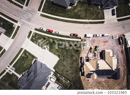 Drone overhead view or a roof installation with felt and water barrier being added. 103321965