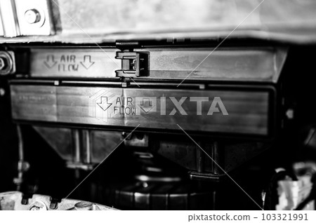 Automotive cabin air filter direction of flow arrow marked on casing.  103321991