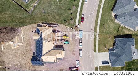Drone overhead view or a roof installation with felt and water barrier being added. 103321993
