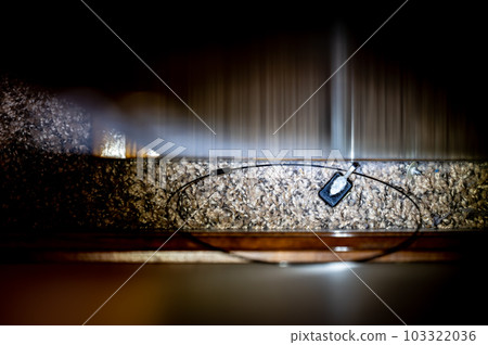 small object dropped behind furniture and trapped between a wall small object dropped behind furniture and trapped between a wall 103322036