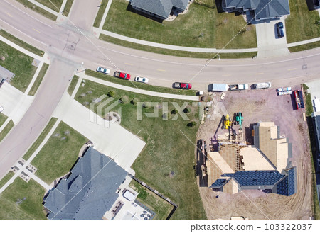 Drone overhead view or a roof installation with felt and water barrier being added. 103322037