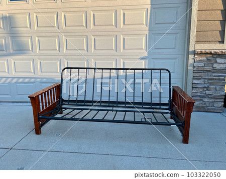futon and frame on the sidewalk driveway of a house for free pickup futon and frame on the sidewalk driveway of a house for free pickup 103322050