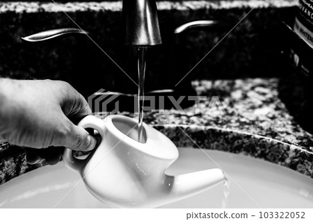 Improperly filling a neti pot with nonsterile tap water. 103322052