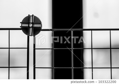 Selective focus on a connecting block on a modular wire cage shelving system Selective focus on a connecting block on a modular wire cage shelving system 103322200