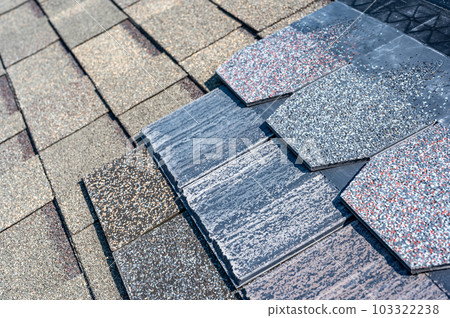 Assorted selection of premium synthetic roof shingles to pick a new style. 103322238