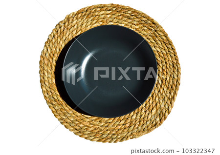 Gray dinner plate on a round woven wicker made of water hyacinth fibers, wicker table mats, rattan round woven mat Gray dinner plate on a round woven wicker made of water hyacinth fibers, wicker table mats, rattan round woven mat 103322347