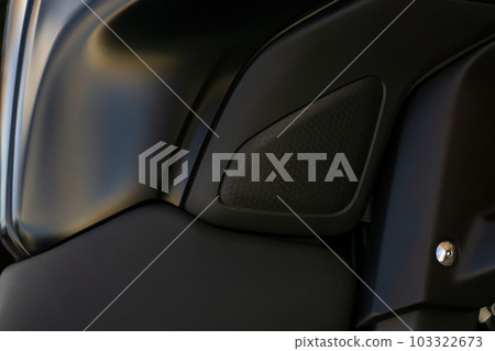 Detail of the tank of a black motorcycle close up 103322673