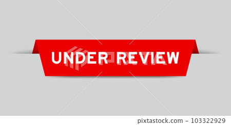 Red color inserted label with word under review on gray background Red color inserted label with word under review on gray background 103322929