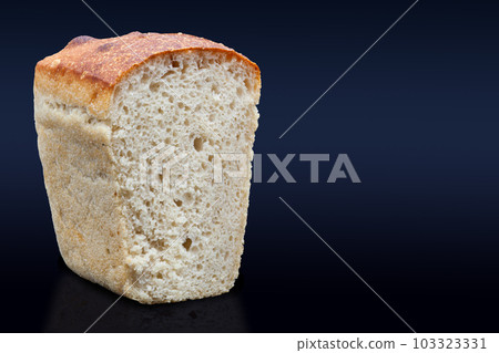 Rye bread on sourdough on a dark background in the section. Rye bread on sourdough on a dark background in the section. 103323331