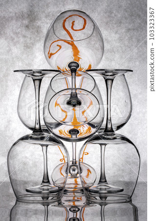 Still life with glass objects on a gray background Still life with glass objects on a gray background 103323367