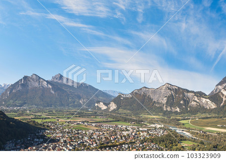 Panorama of the city of Bad Ragaz against the background of the Swiss Alps at sunset. Bad Ragaz Switzerland. Aerial view. Top view Panorama of the city of Bad Ragaz against the background of the Swiss Alps at sunset. Bad Ragaz Switzerland. Aerial view. Top view 103323909